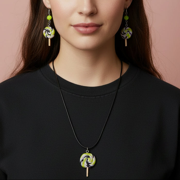 model wearing a Jewelry set with lollipop-shaped pendant necklace and earrings on a blush background