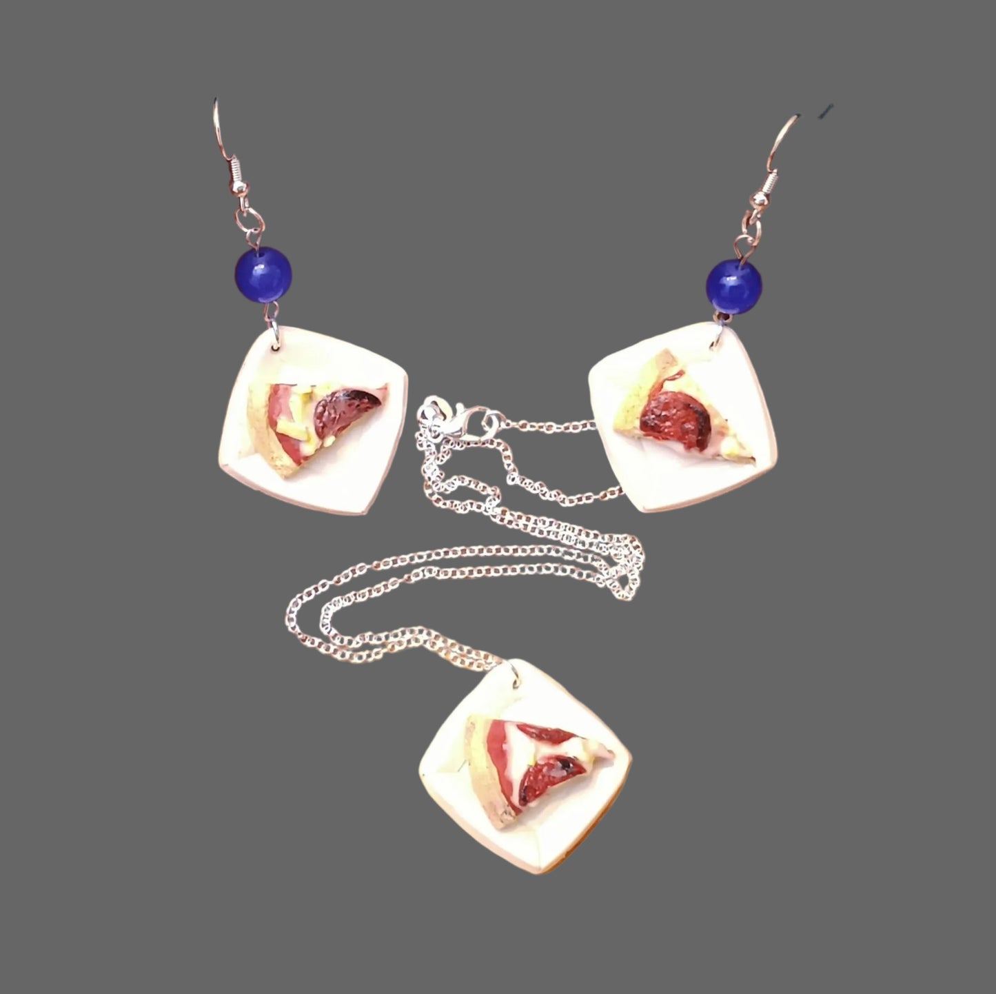 pizza slice jewelry set on gray background