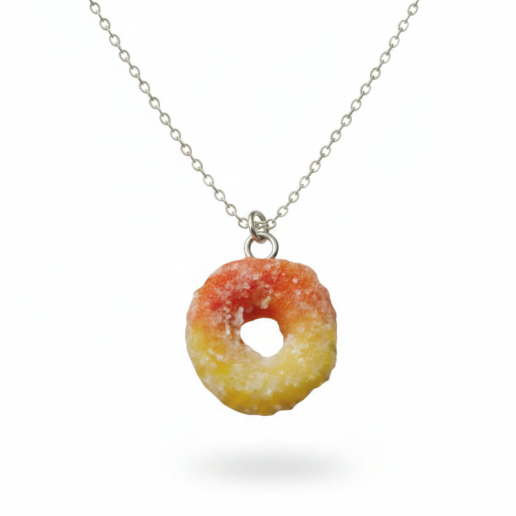 Necklace with a colorful ring shaped pendant on a white background
