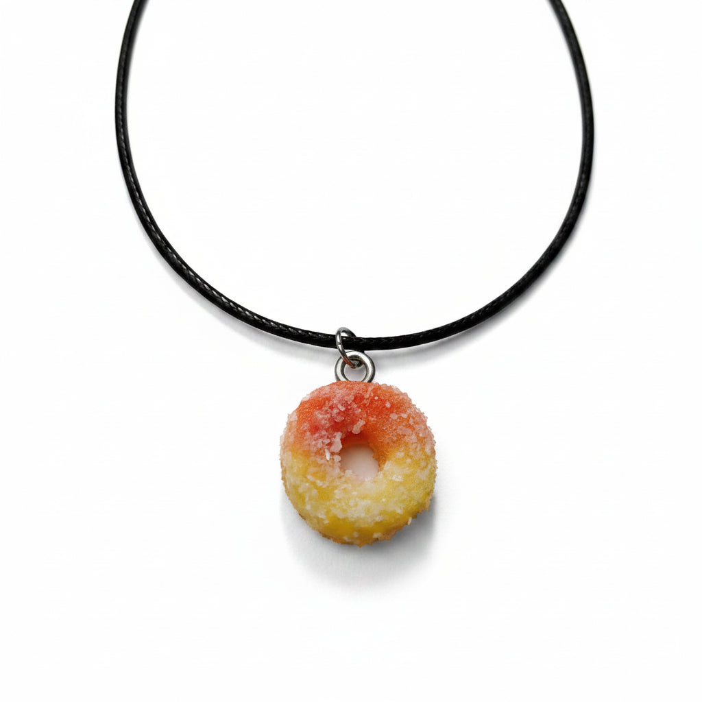 Necklace with a peach ring pendant on a yellow background