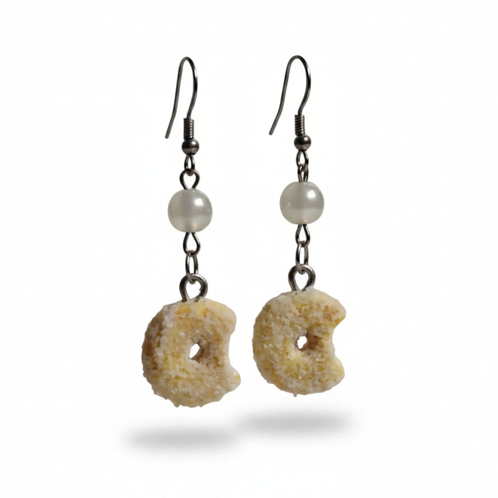 Donut shaped pendant earrings white background