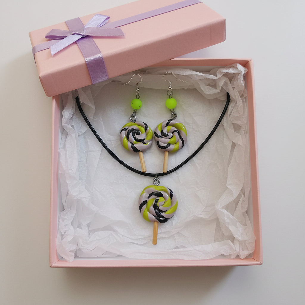 Jewelry set with lollipop-shaped pendant necklace and earrings on a white background