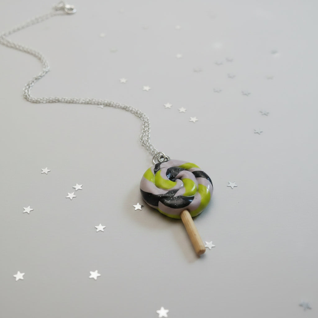 Necklace with a lollipop-shaped pendant on a light gray background