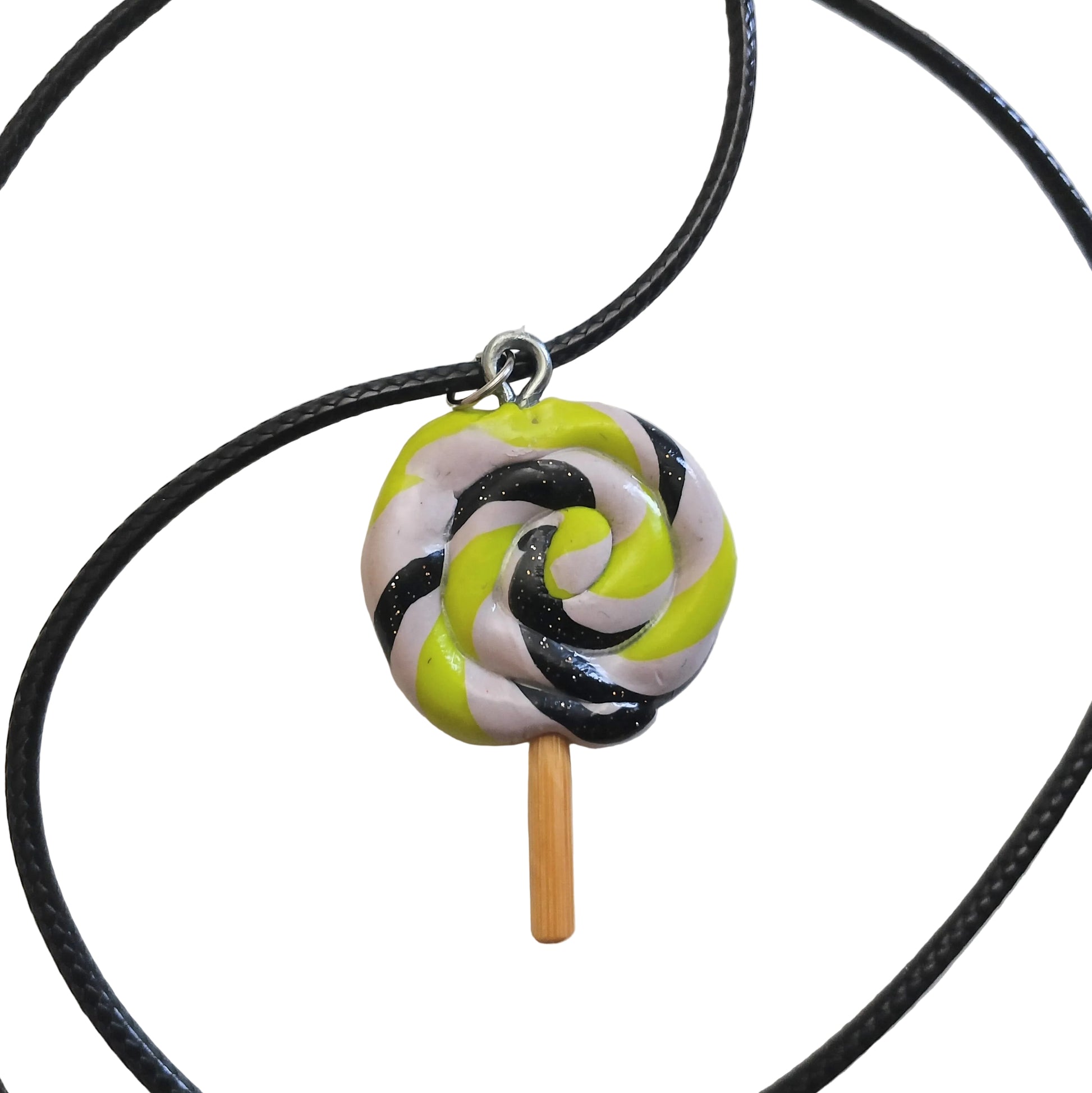 Lollipop-shaped pendant on a black cord against a white background