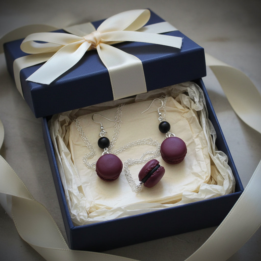 Pair of maroon and black macaron-shaped earrings gift wrapped