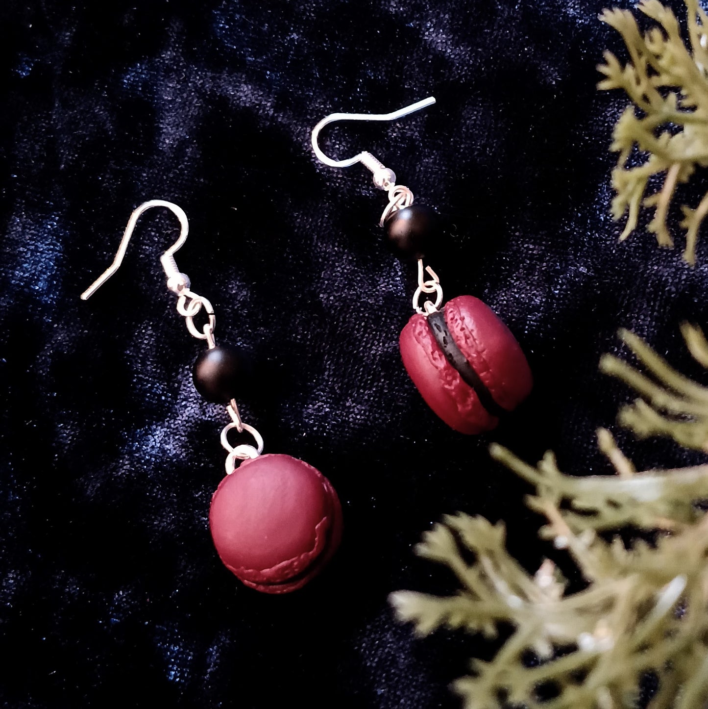 macaron earrings on navy velvet background
