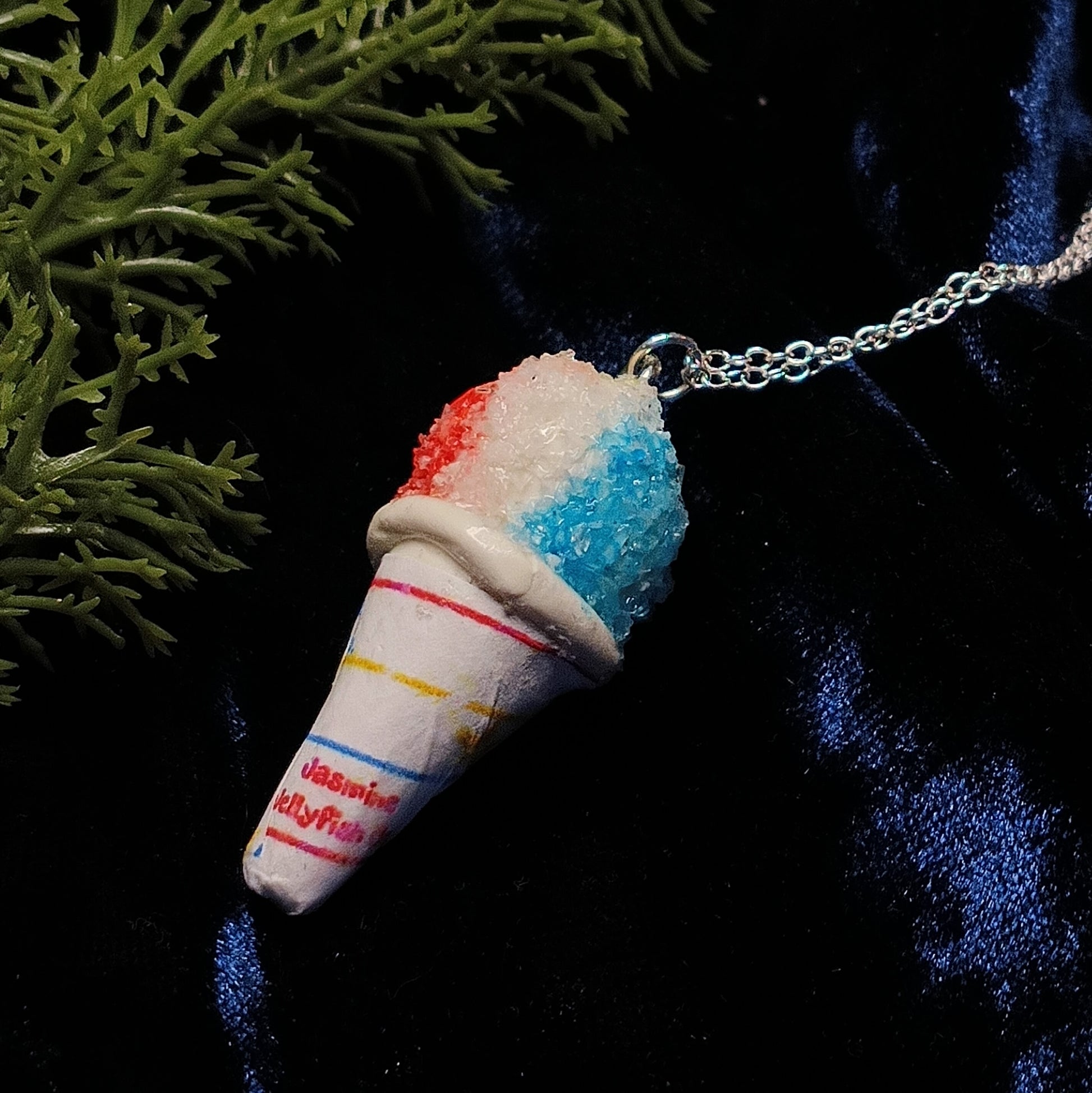 snow cone necklace on dark background