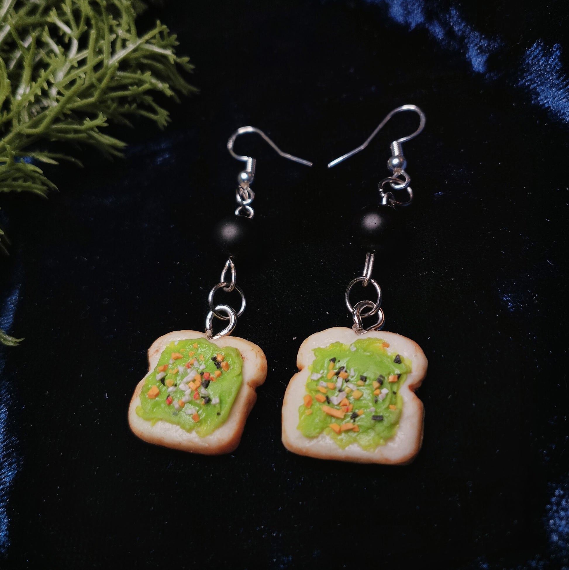 Avocado Toast Earrings on dark background