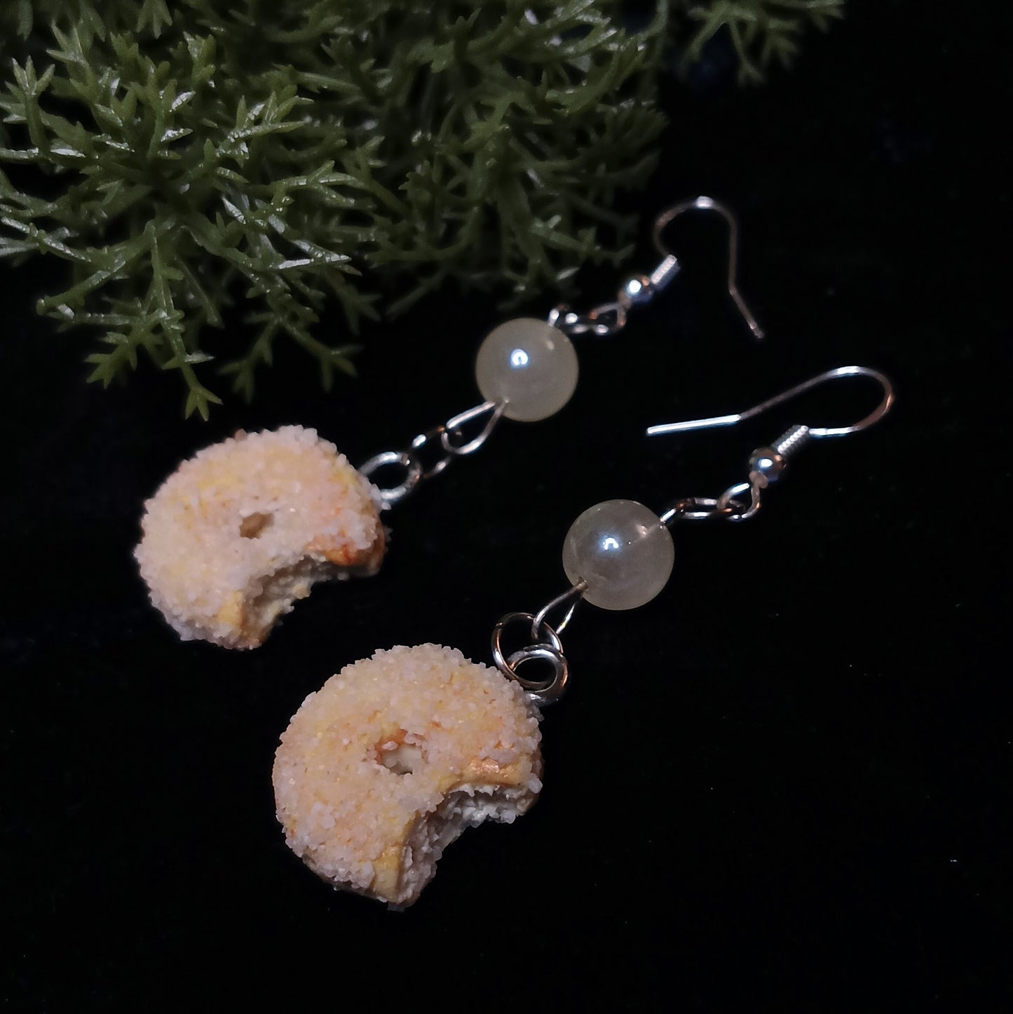 sugar donut earrings on navy background
