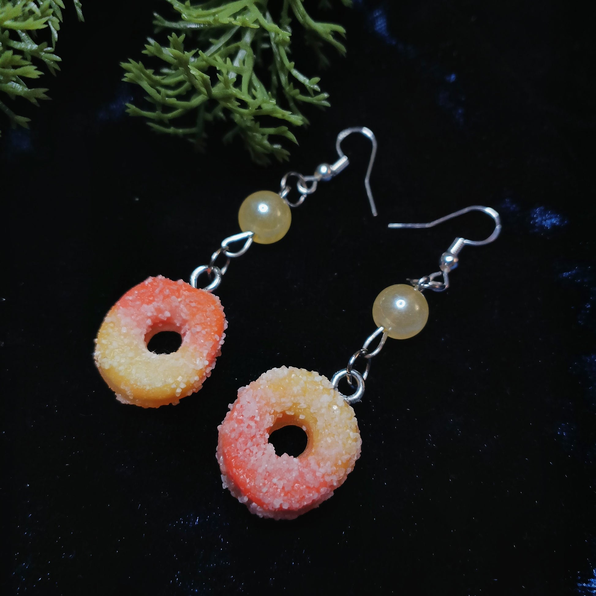 Peach Ring earrings on navy blue background