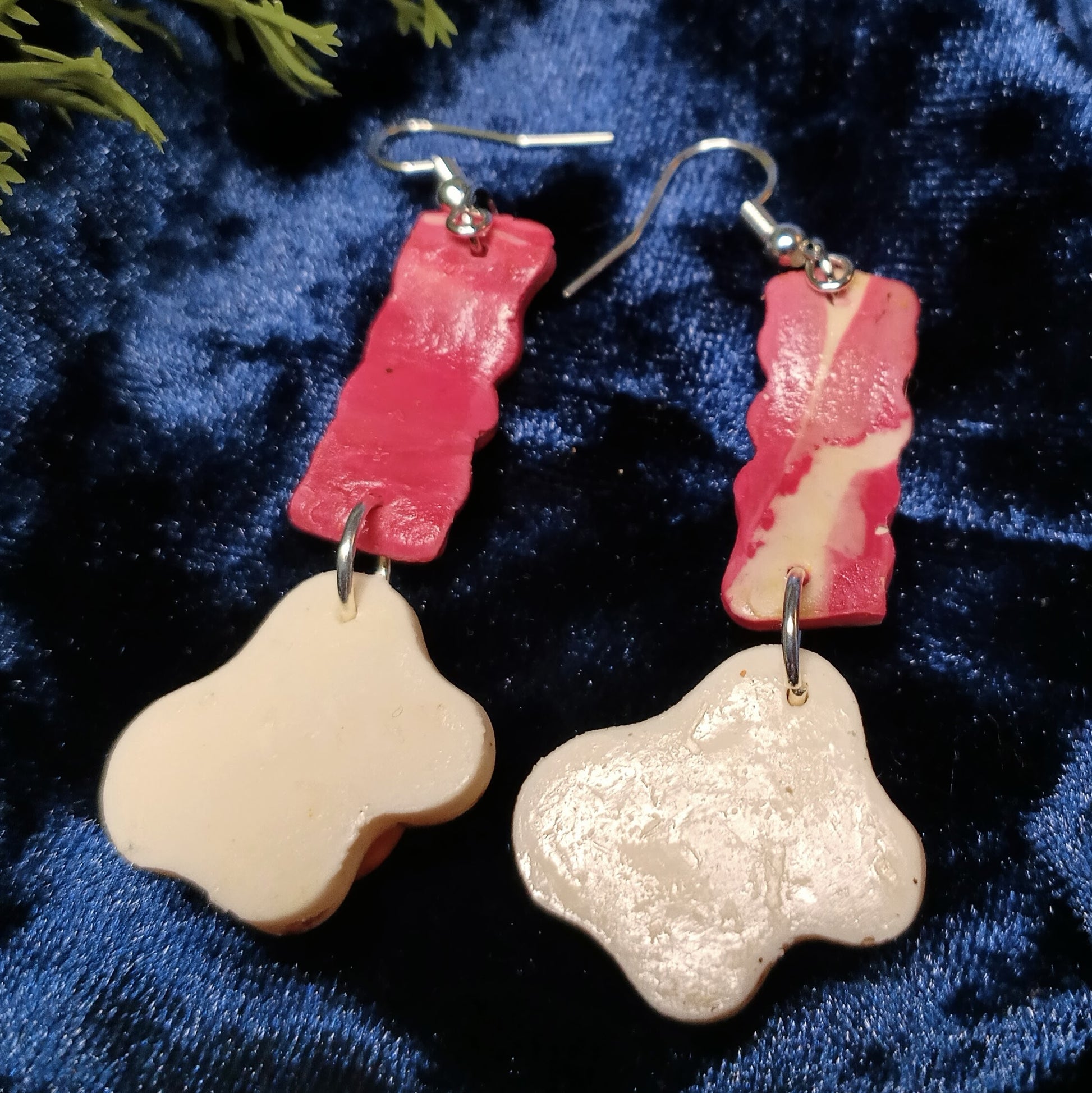 back of earrings on dark blue background