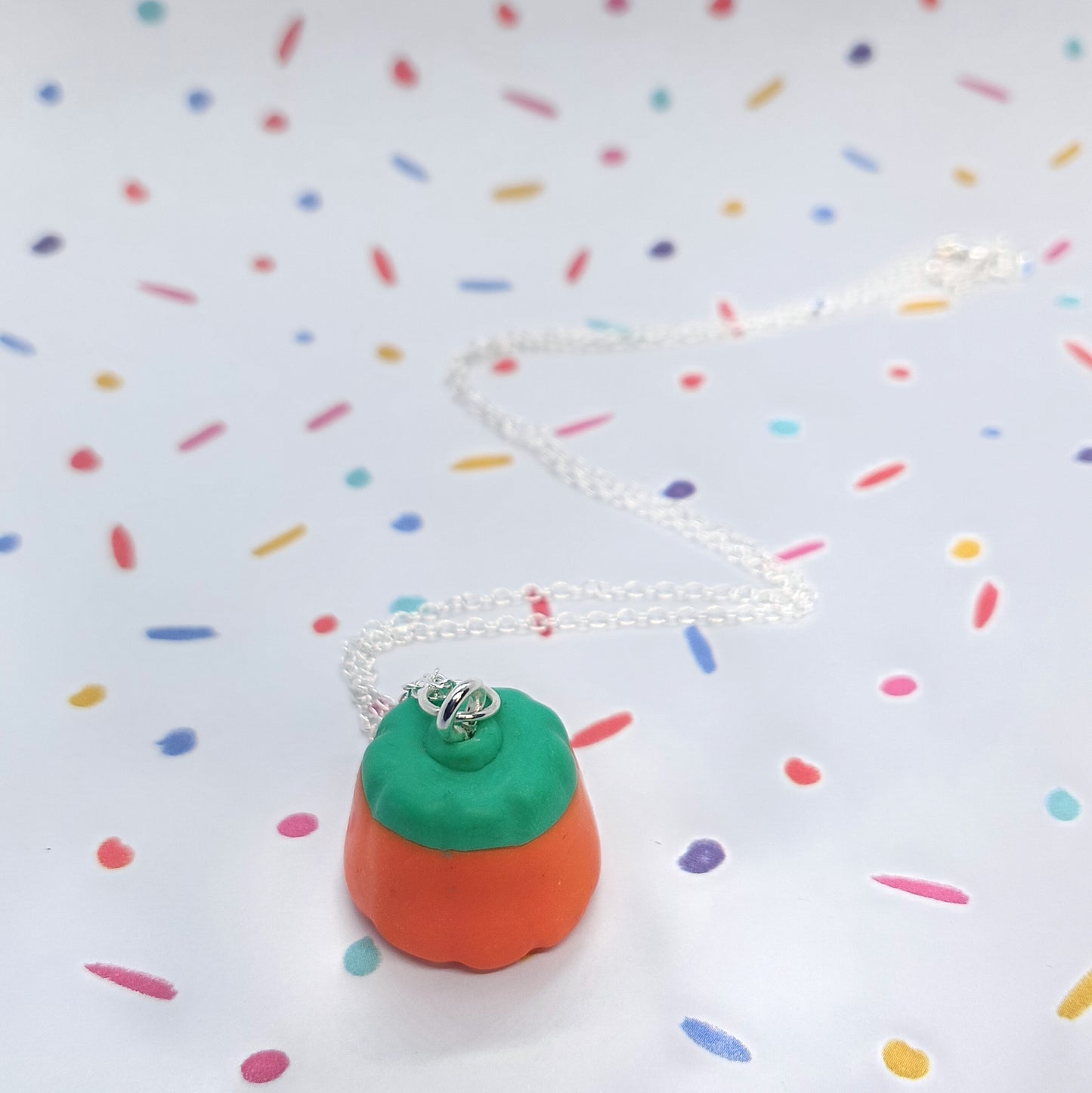 pumpkin candy corn necklace n silver chain flat lay 
