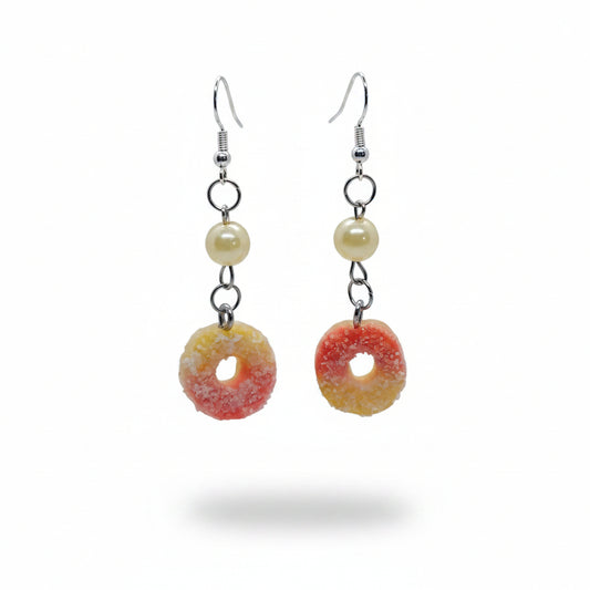 A pair of novelty drop earrings designed to look like sour candy, against a white background.