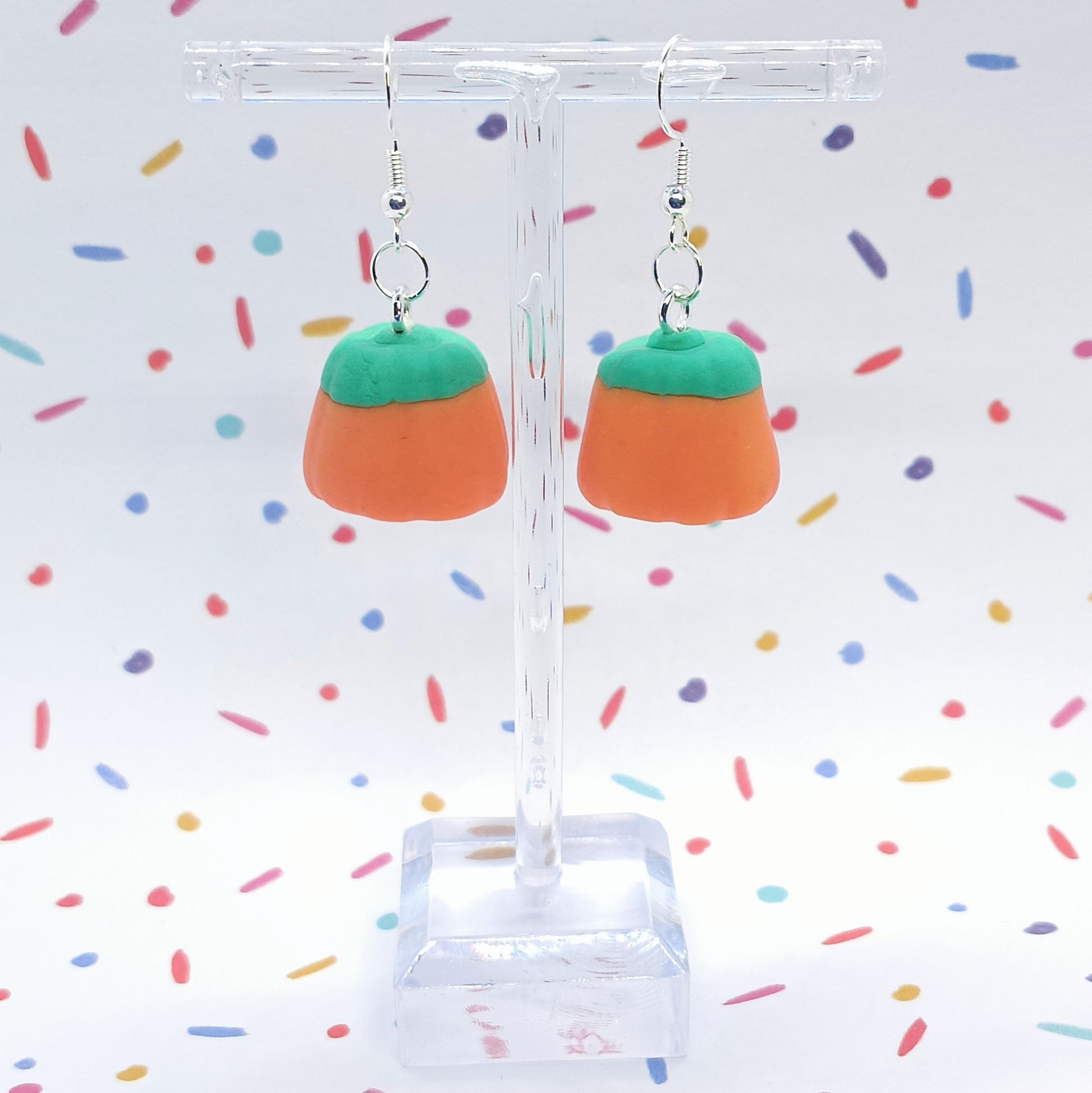 Pumpkin Candy Corn Earrings confetti background 