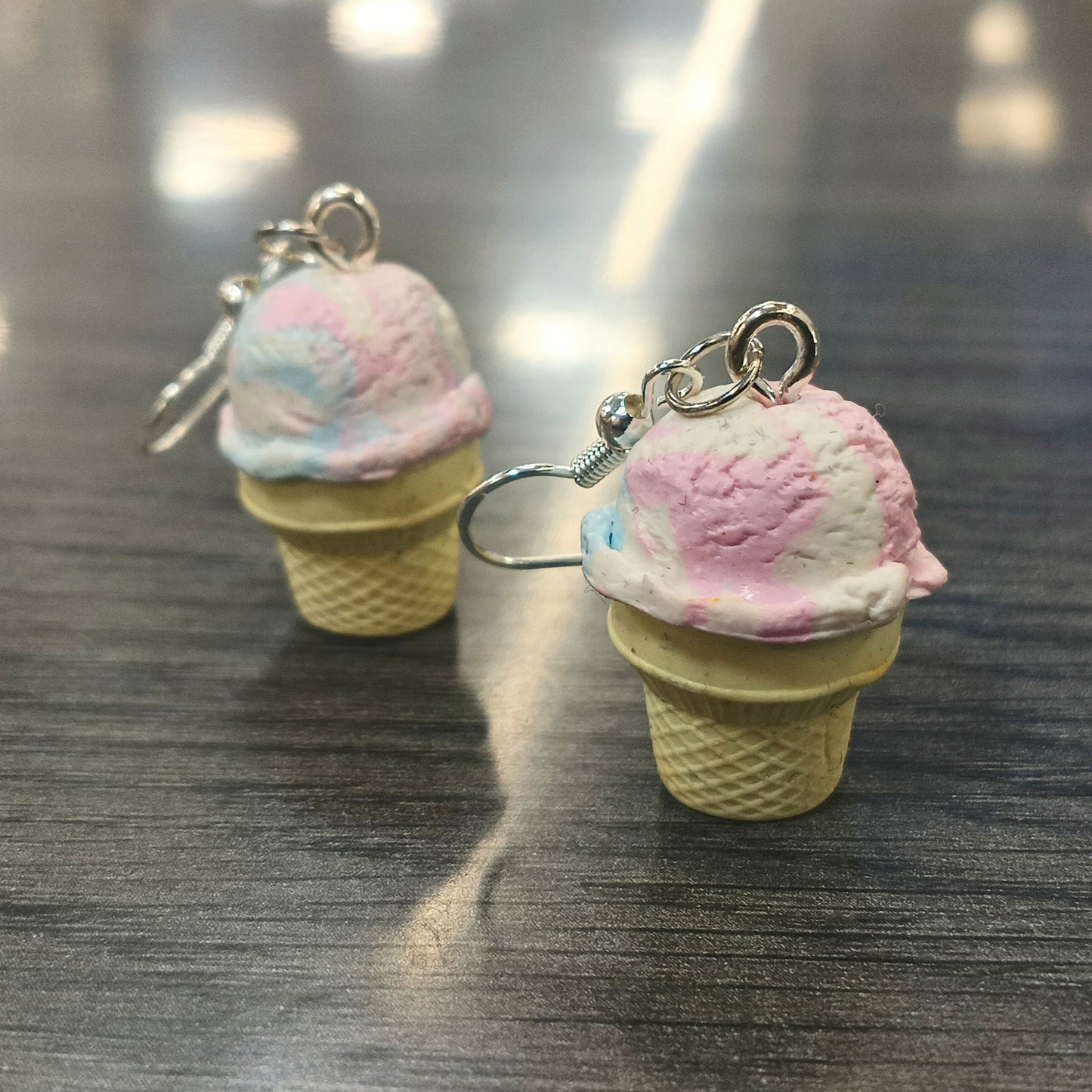ice cream earrings on gray wood table