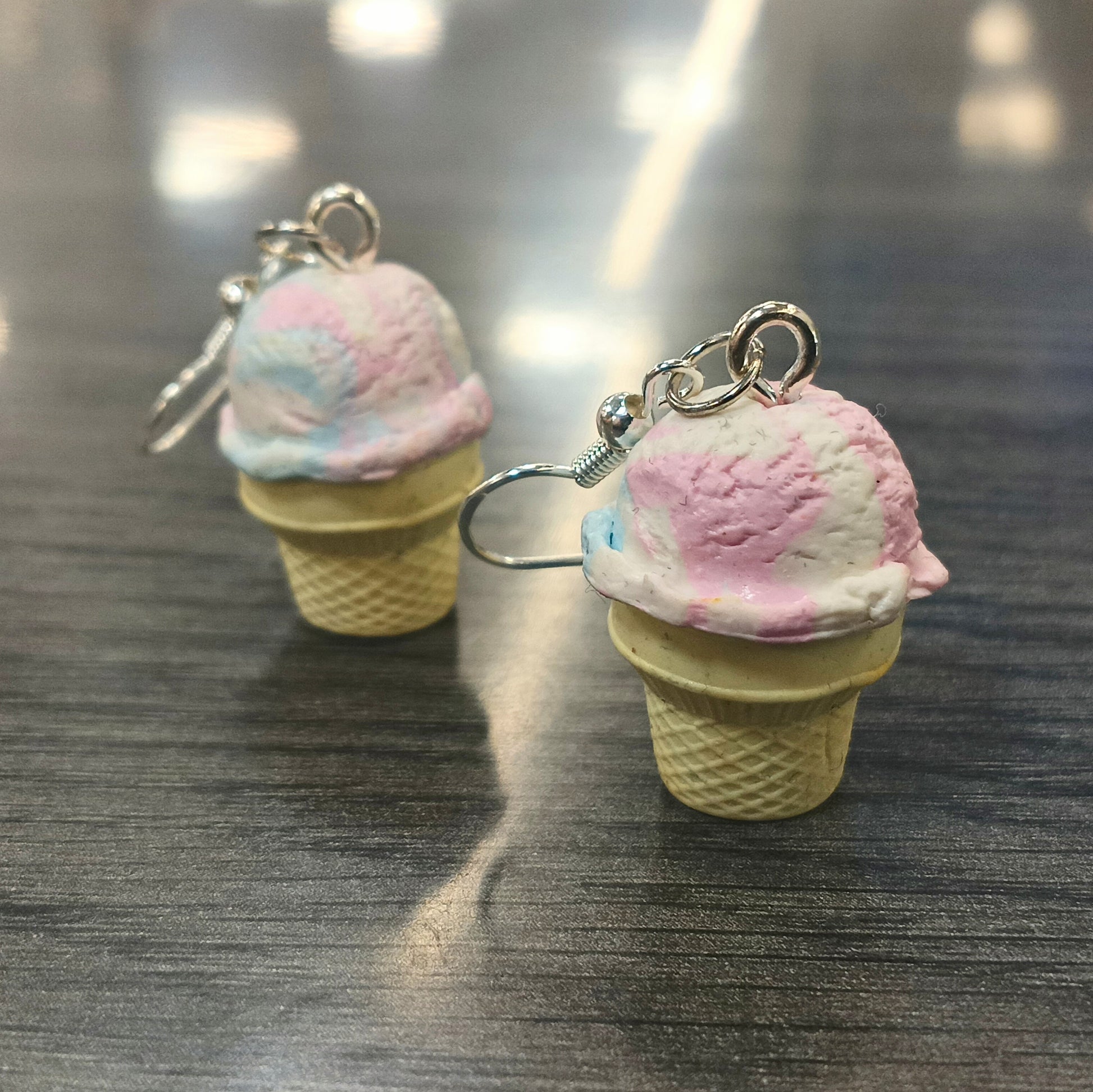 ice cream earrings on gray wood table