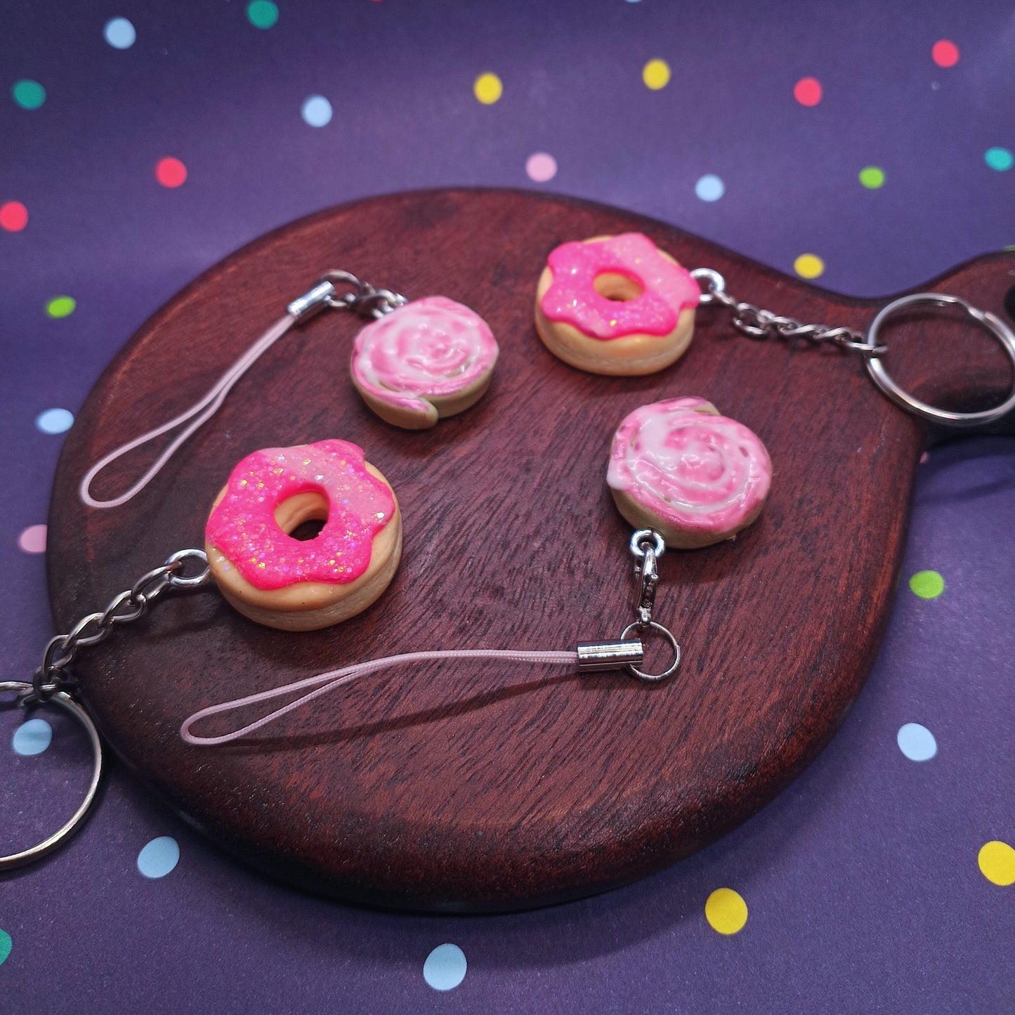 Pink donut keychains and pink cinnamon roll charms 