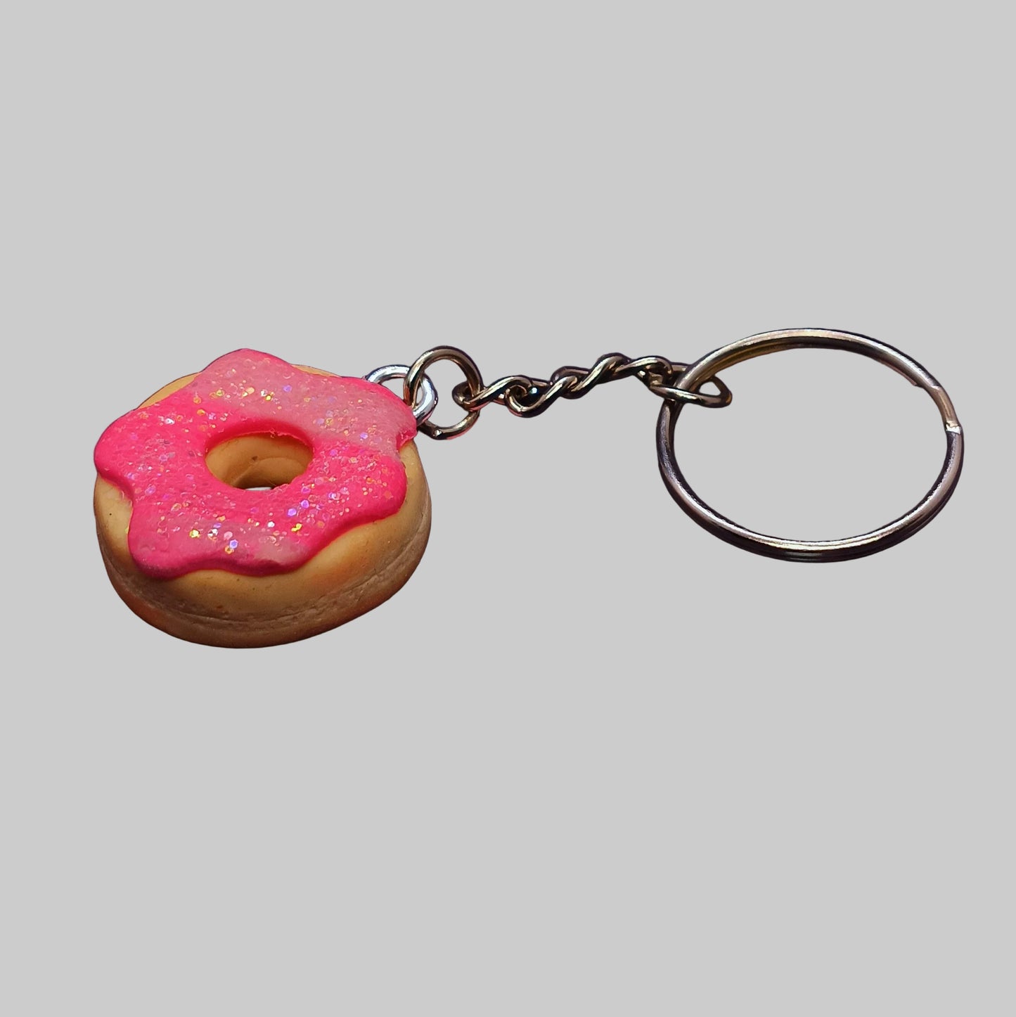 side angle pink sparkly donut Keychain 