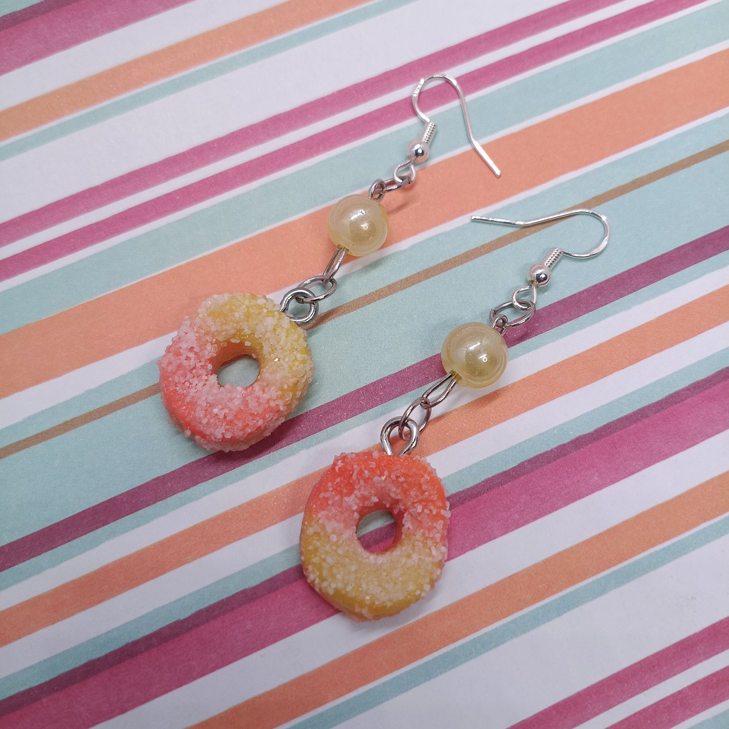 Peach Rings Earrings on striped background